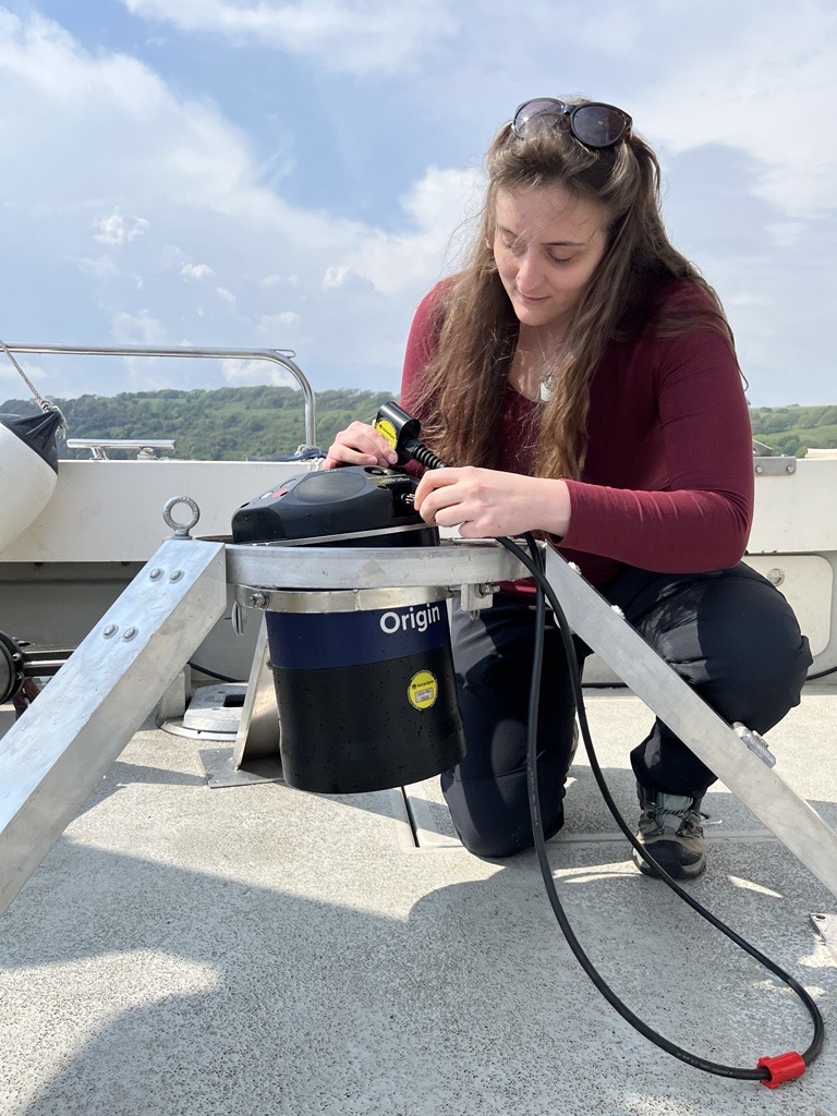 Picture of Chloe working on the deck of a boat